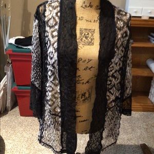 Open light weight lace jacket in black and white.